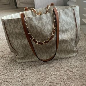 Purse is in good condition. No outside pockets. Gold MK plate